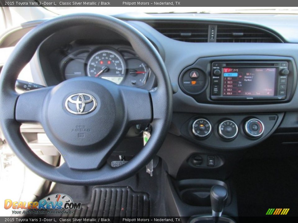 Dashboard of 2015 Toyota Yaris 3-Door L Photo #20