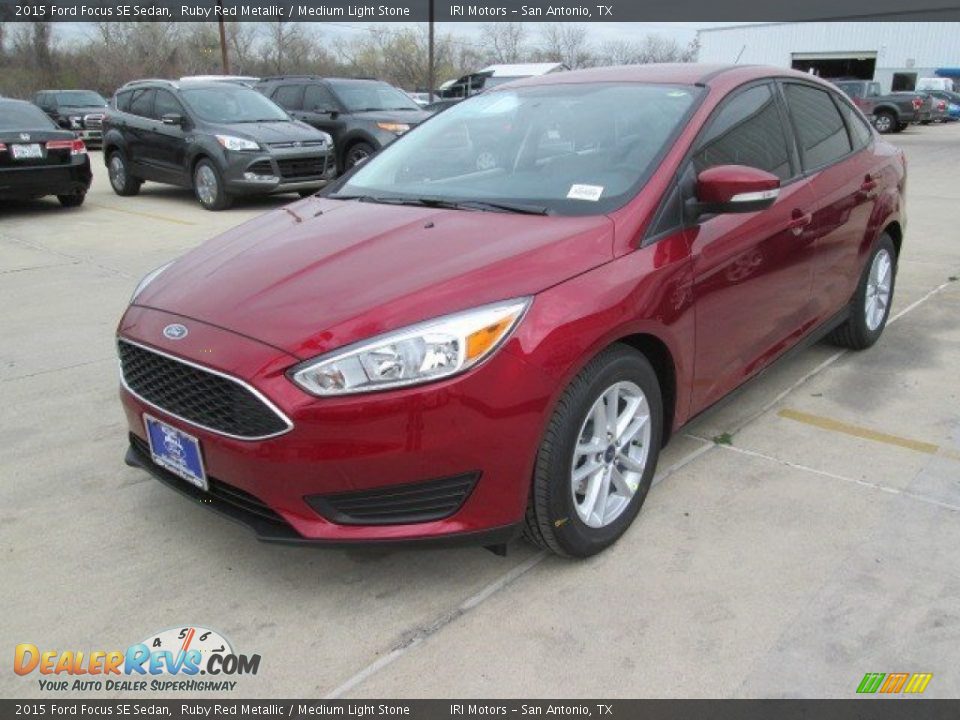 2015 Ford Focus SE Sedan Ruby Red Metallic / Medium Light Stone Photo #5