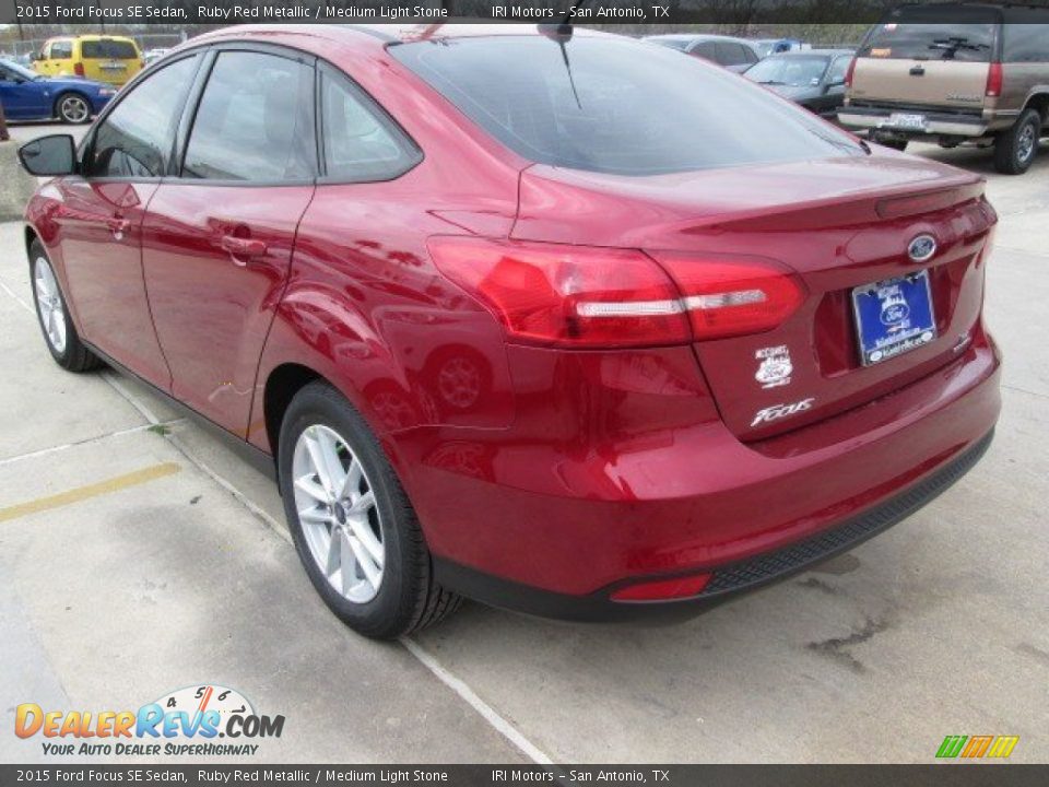 2015 Ford Focus SE Sedan Ruby Red Metallic / Medium Light Stone Photo #7