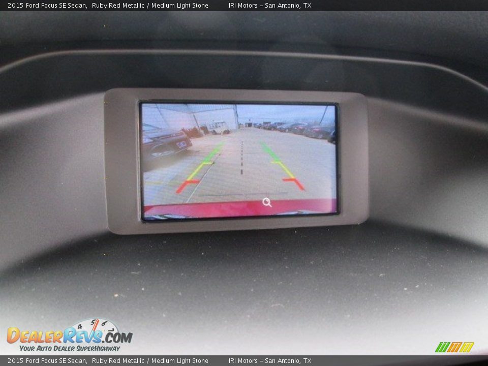 2015 Ford Focus SE Sedan Ruby Red Metallic / Medium Light Stone Photo #23