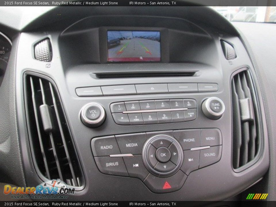 2015 Ford Focus SE Sedan Ruby Red Metallic / Medium Light Stone Photo #24