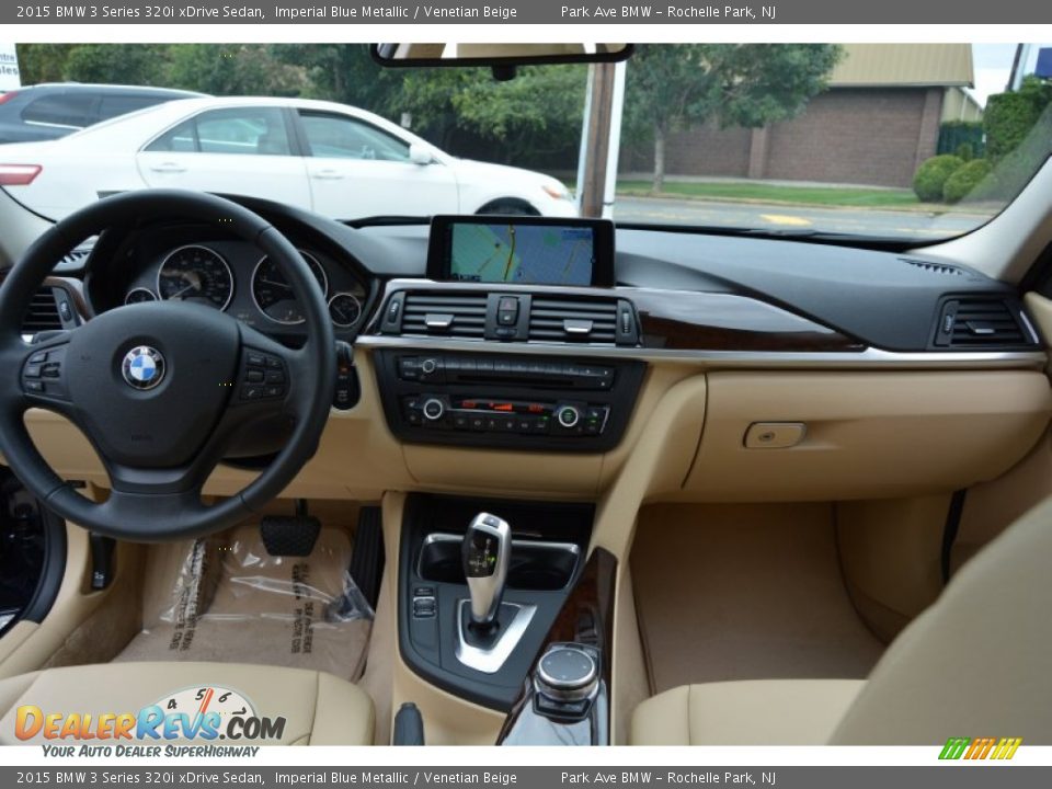 Dashboard of 2015 BMW 3 Series 320i xDrive Sedan Photo #16