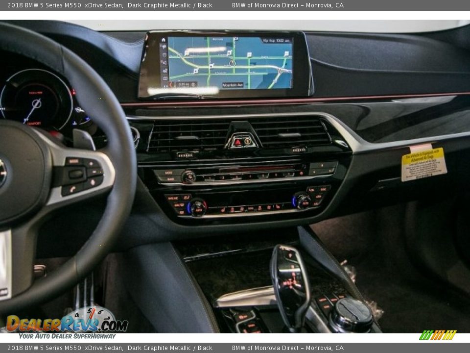 Controls of 2018 BMW 5 Series M550i xDrive Sedan Photo #6
