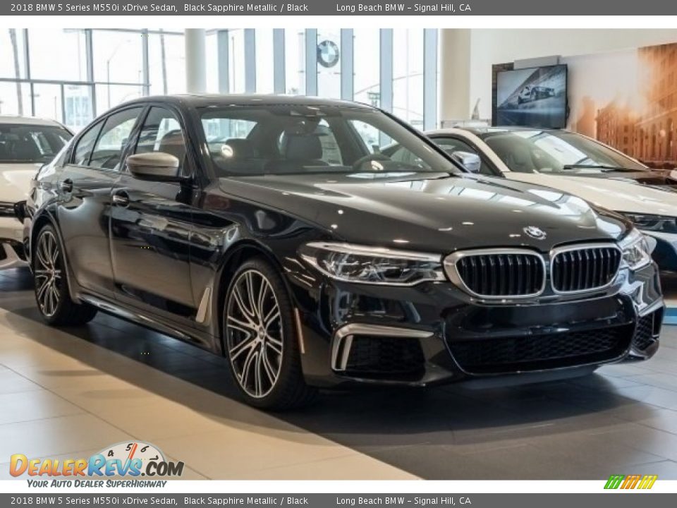 Front 3/4 View of 2018 BMW 5 Series M550i xDrive Sedan Photo #11