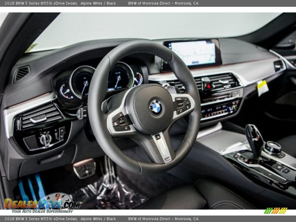 Dashboard of 2018 BMW 5 Series M550i xDrive Sedan Photo #5