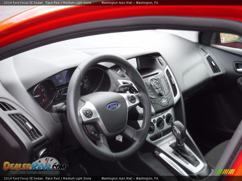 2014 Ford Focus SE Sedan Race Red / Medium Light Stone Photo #12