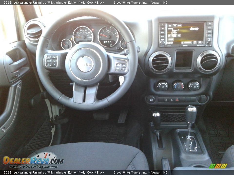 Dashboard of 2018 Jeep Wrangler Unlimited Willys Wheeler Edition 4x4 Photo #27