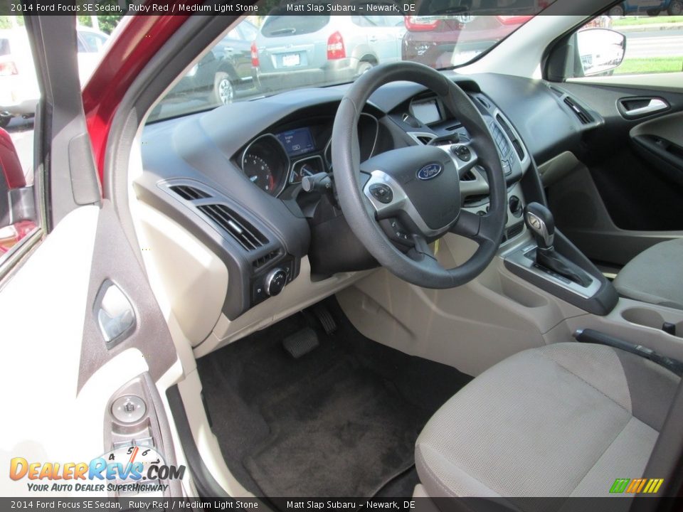 2014 Ford Focus SE Sedan Ruby Red / Medium Light Stone Photo #12