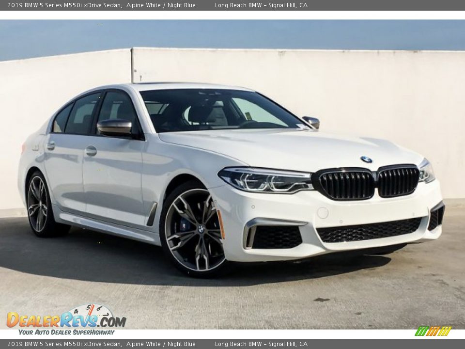 Front 3/4 View of 2019 BMW 5 Series M550i xDrive Sedan Photo #12