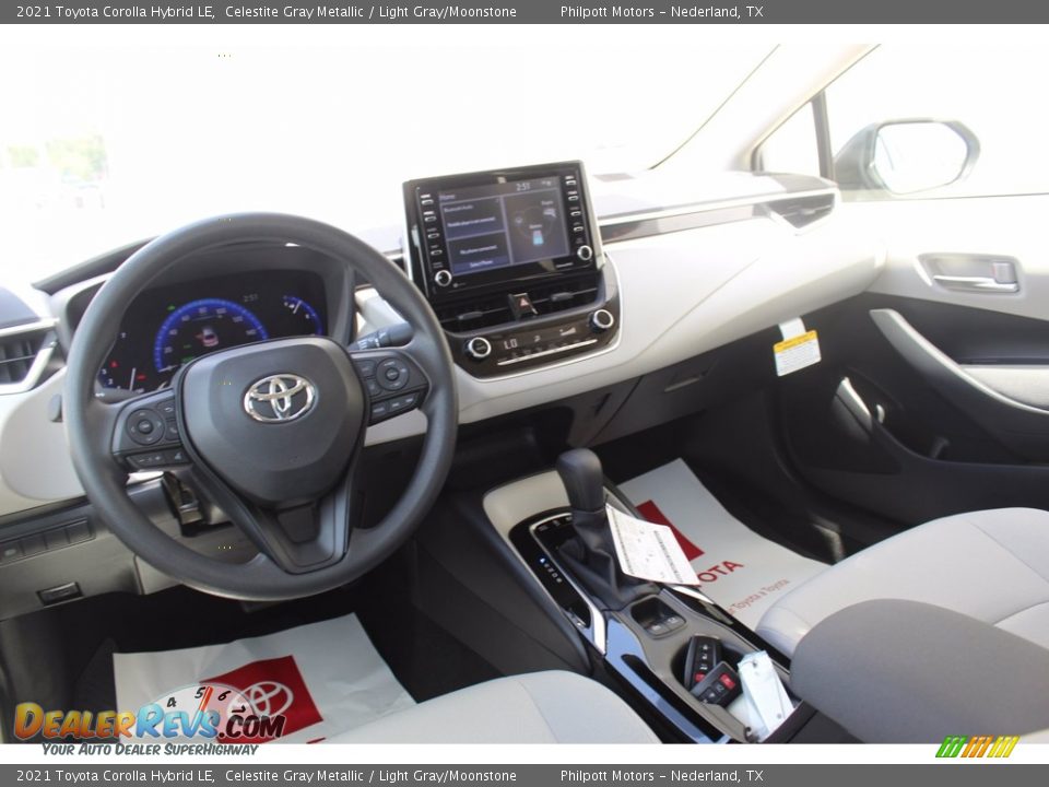 Dashboard of 2021 Toyota Corolla Hybrid LE Photo #21
