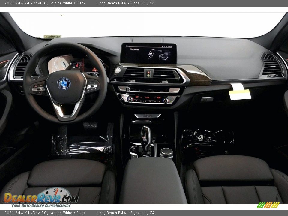 Dashboard of 2021 BMW X4 xDrive30i Photo #5