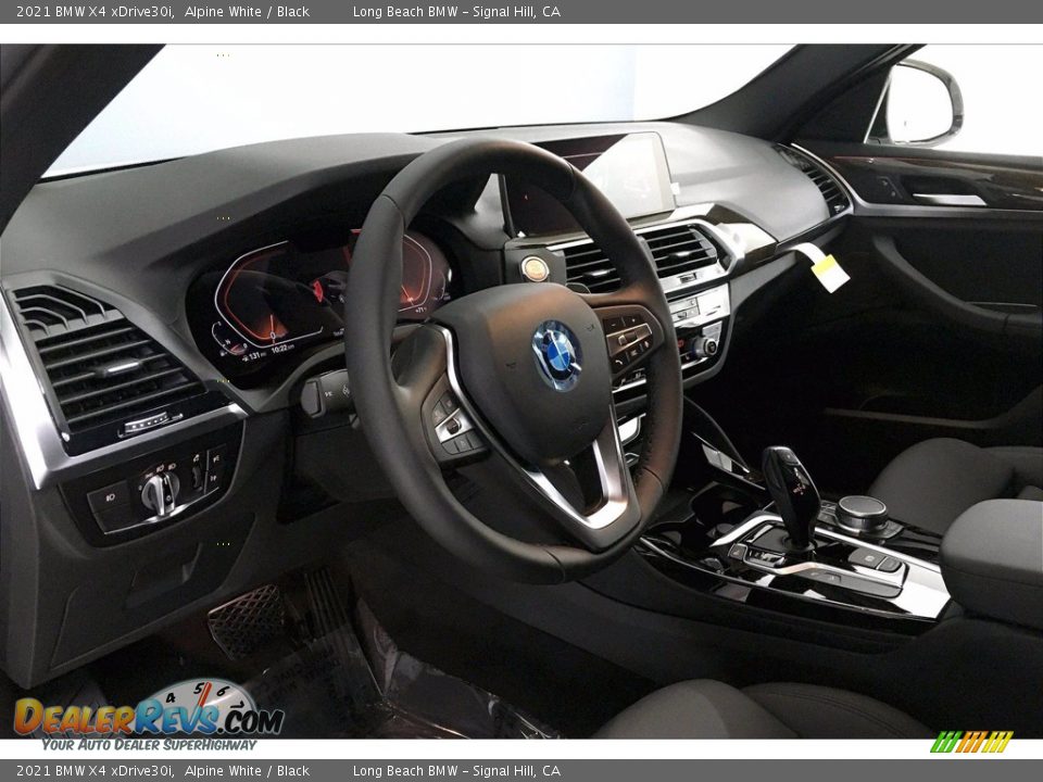Dashboard of 2021 BMW X4 xDrive30i Photo #7