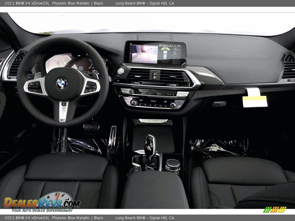 Dashboard of 2021 BMW X4 xDrive30i Photo #5