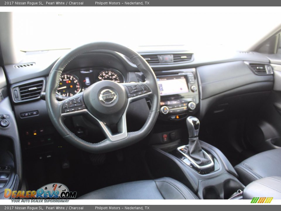 Dashboard of 2017 Nissan Rogue SL Photo #26