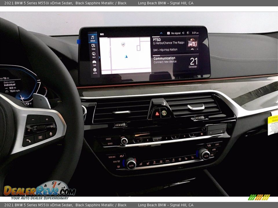 Controls of 2021 BMW 5 Series M550i xDrive Sedan Photo #6