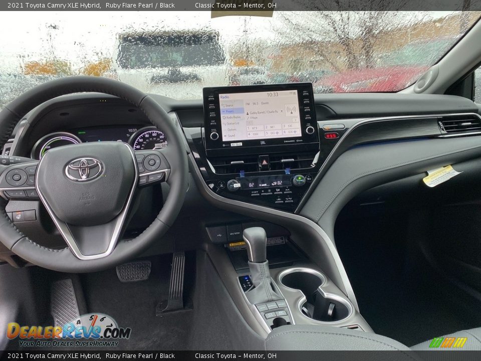 Dashboard of 2021 Toyota Camry XLE Hybrid Photo #4