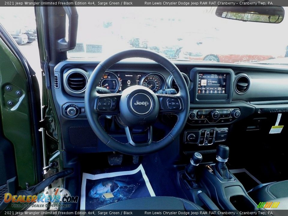 Dashboard of 2021 Jeep Wrangler Unlimited Freedom Edition 4x4 Photo #13
