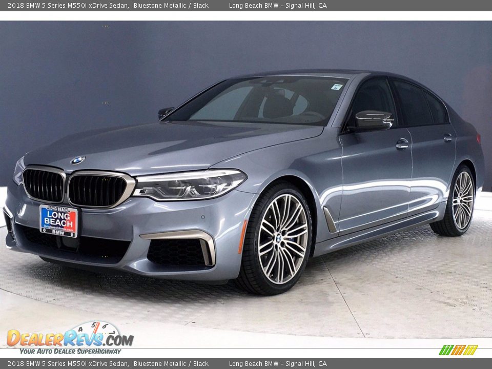 Front 3/4 View of 2018 BMW 5 Series M550i xDrive Sedan Photo #12