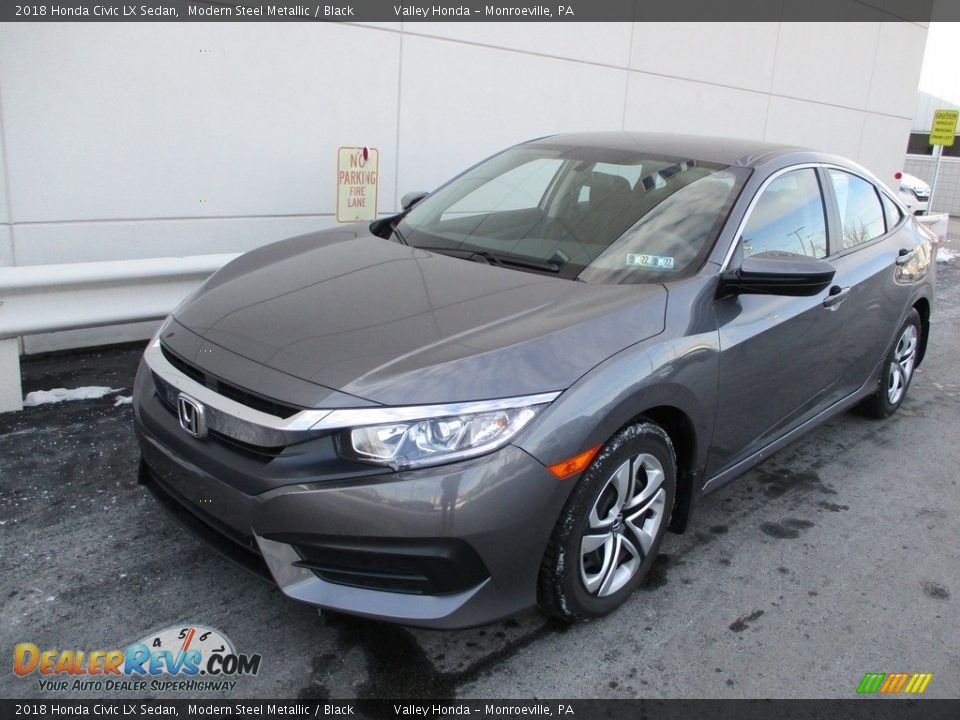 Front 3/4 View of 2018 Honda Civic LX Sedan Photo #9