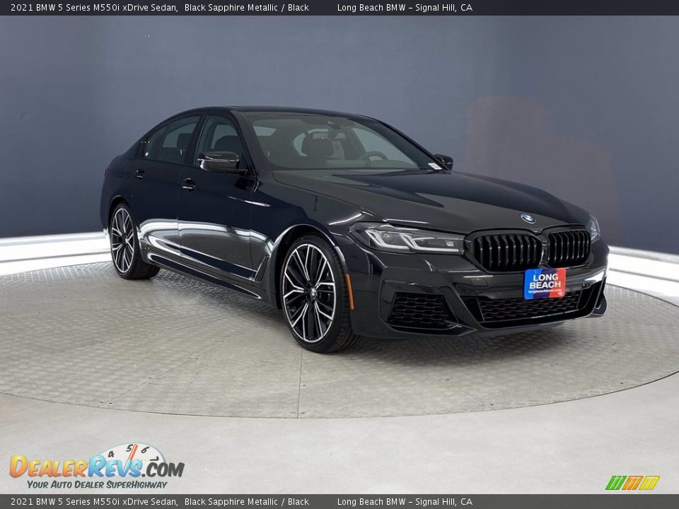 Front 3/4 View of 2021 BMW 5 Series M550i xDrive Sedan Photo #27