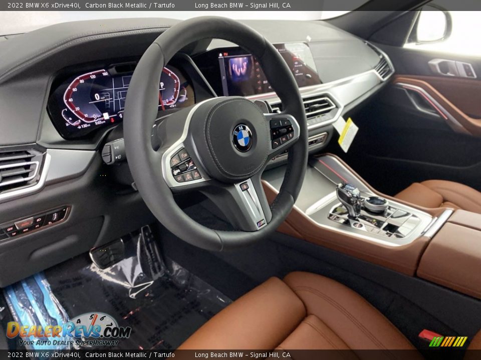 Dashboard of 2022 BMW X6 xDrive40i Photo #12
