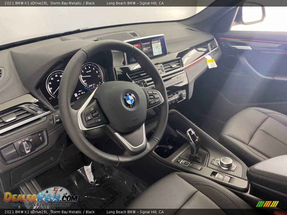 Dashboard of 2021 BMW X1 sDrive28i Photo #12