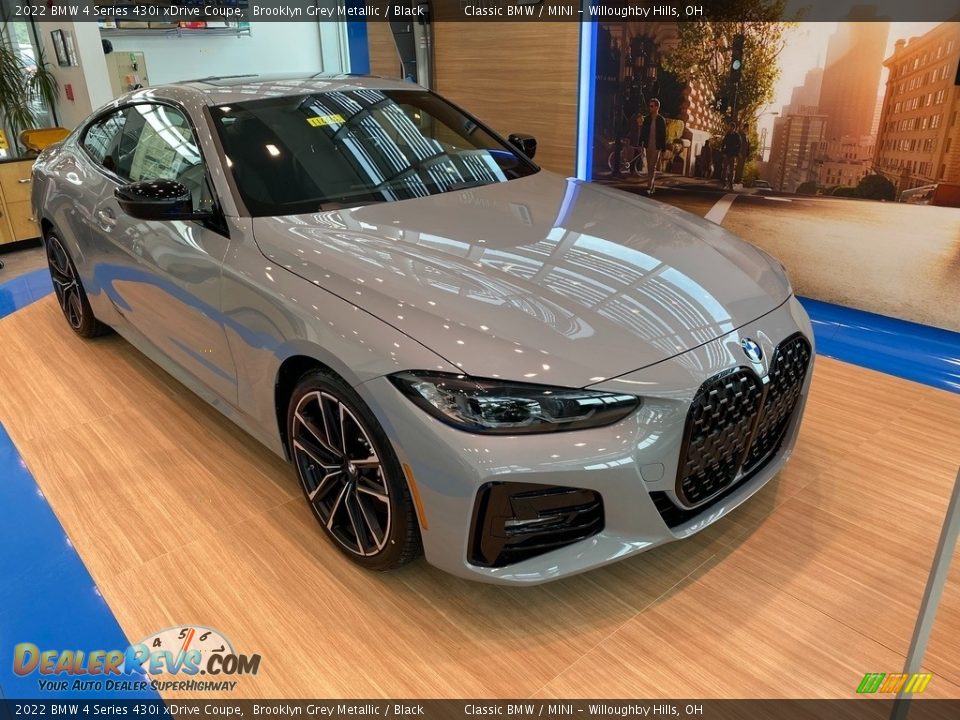 Front 3/4 View of 2022 BMW 4 Series 430i xDrive Coupe Photo #1