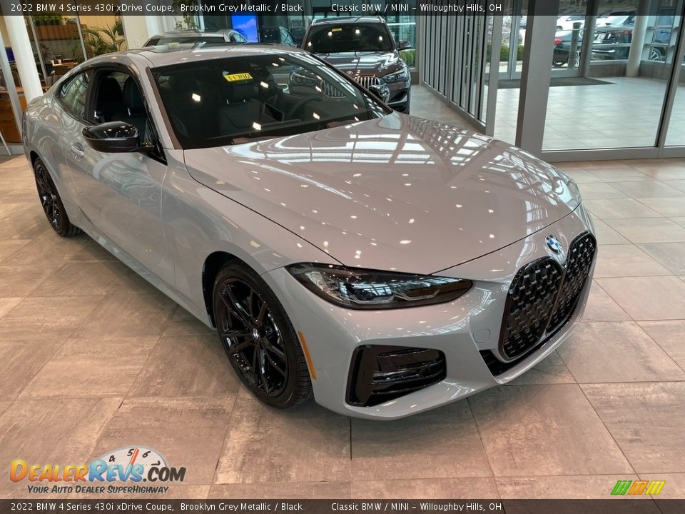Front 3/4 View of 2022 BMW 4 Series 430i xDrive Coupe Photo #1