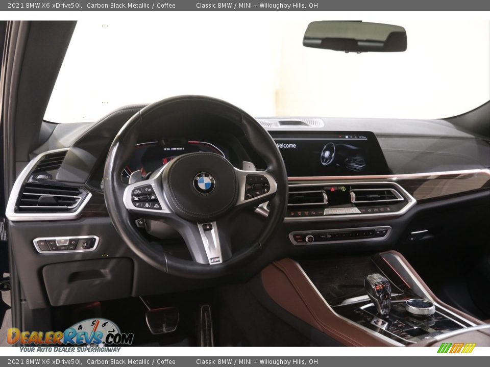 Dashboard of 2021 BMW X6 xDrive50i Photo #6