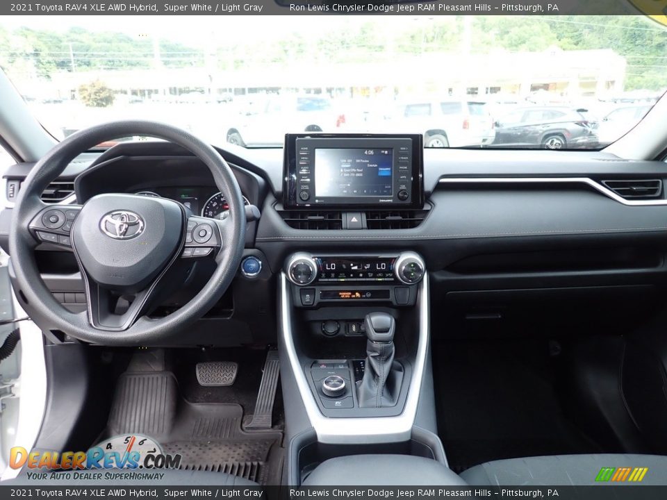 Dashboard of 2021 Toyota RAV4 XLE AWD Hybrid Photo #13