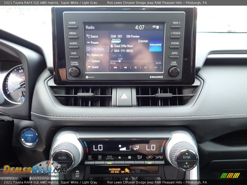 Controls of 2021 Toyota RAV4 XLE AWD Hybrid Photo #19