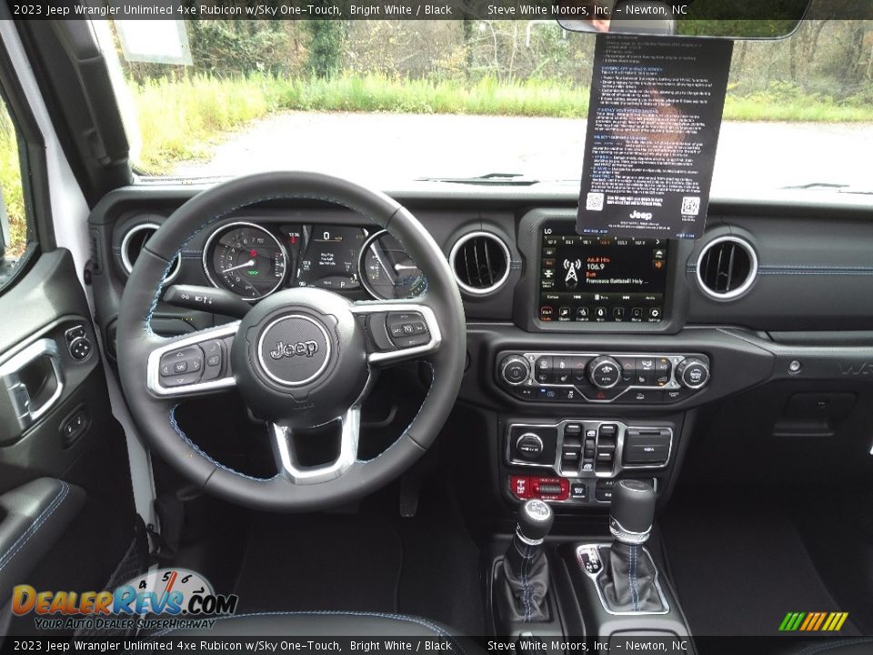 Dashboard of 2023 Jeep Wrangler Unlimited 4xe Rubicon w/Sky One-Touch Photo #21