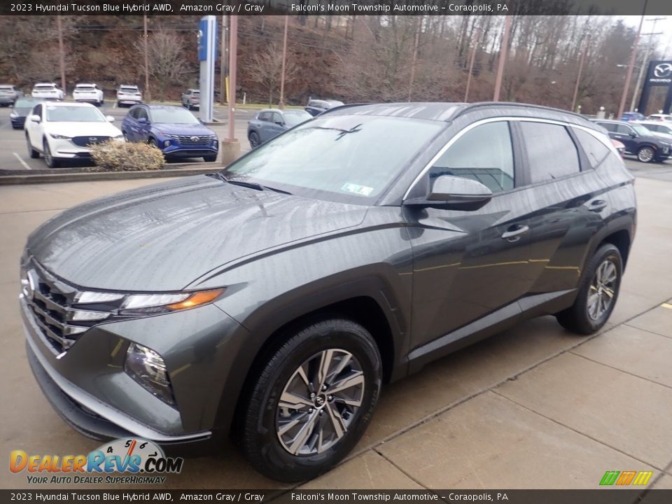 Front 3/4 View of 2023 Hyundai Tucson Blue Hybrid AWD Photo #7