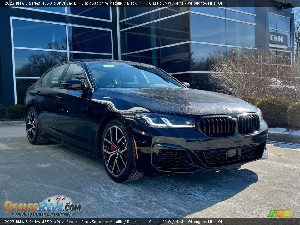 Front 3/4 View of 2023 BMW 5 Series M550i xDrive Sedan Photo #1