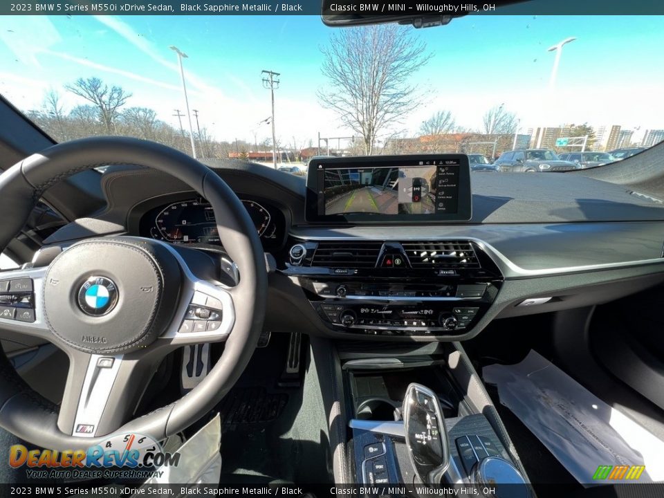 Dashboard of 2023 BMW 5 Series M550i xDrive Sedan Photo #5