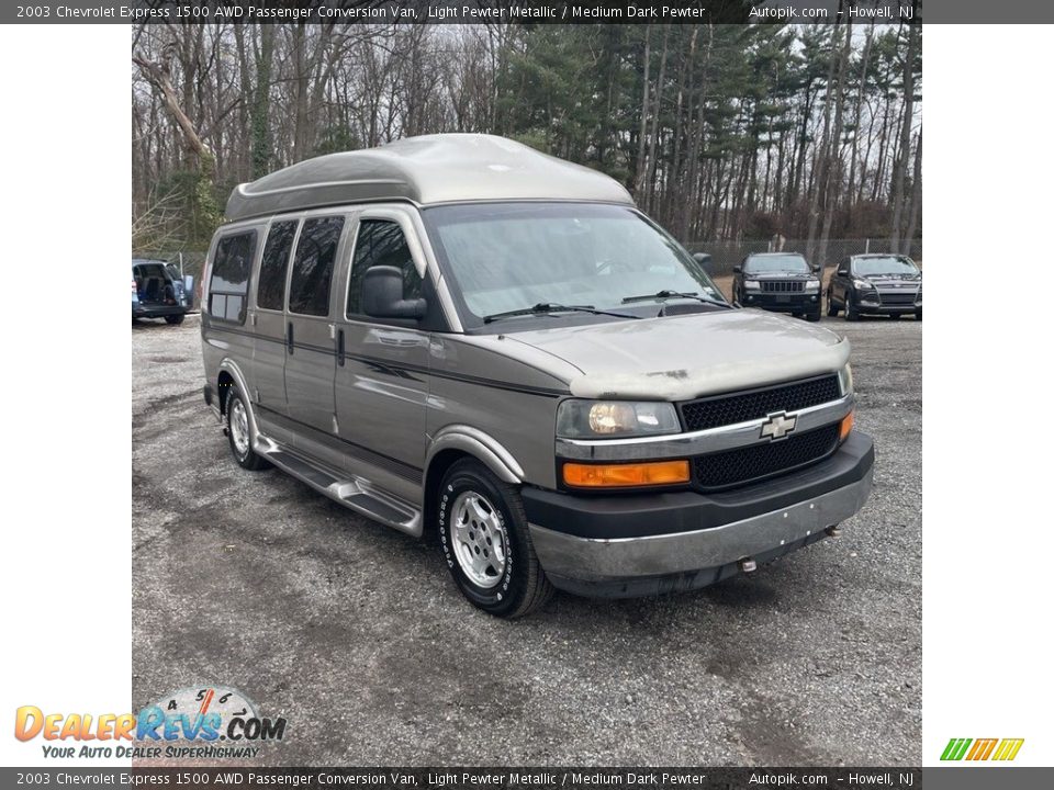 Front 3/4 View of 2003 Chevrolet Express 1500 AWD Passenger Conversion Van Photo #2
