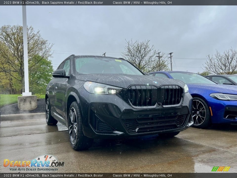 2023 BMW X1 xDrive28i Black Sapphire Metallic / Red/Black Bicolor Photo #1