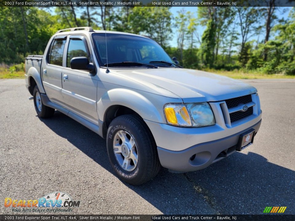 Front 3/4 View of 2003 Ford Explorer Sport Trac XLT 4x4 Photo #7