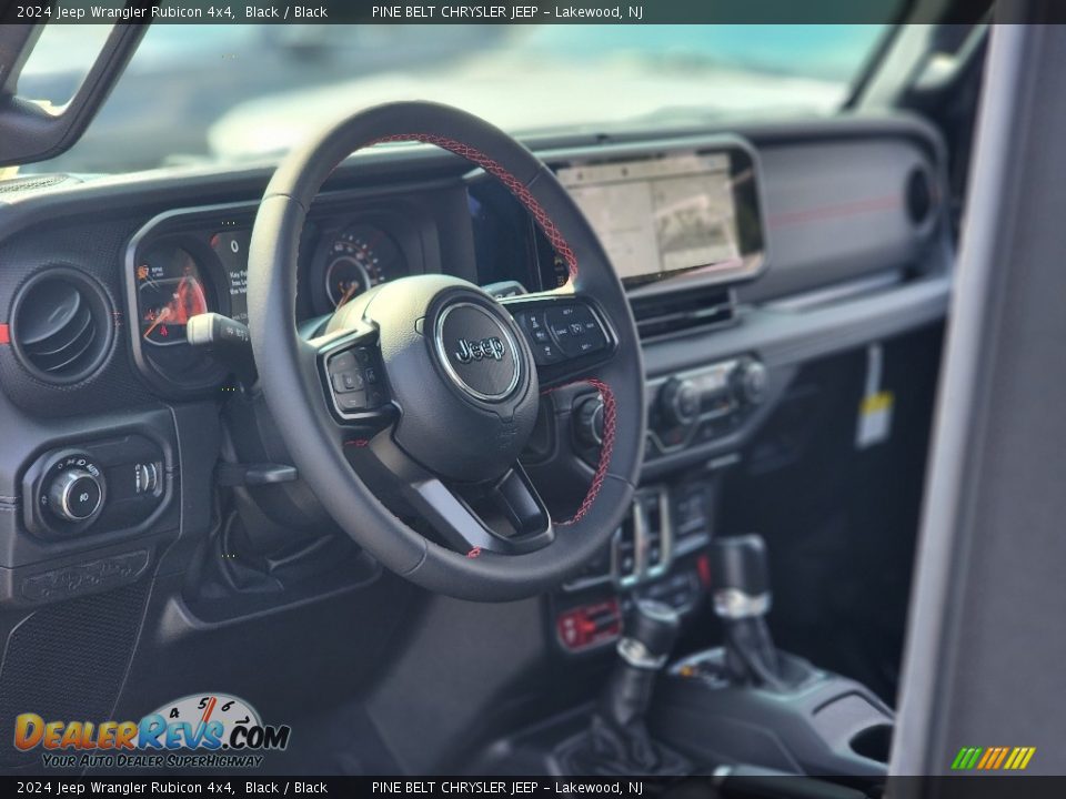 Dashboard of 2024 Jeep Wrangler Rubicon 4x4 Photo #12