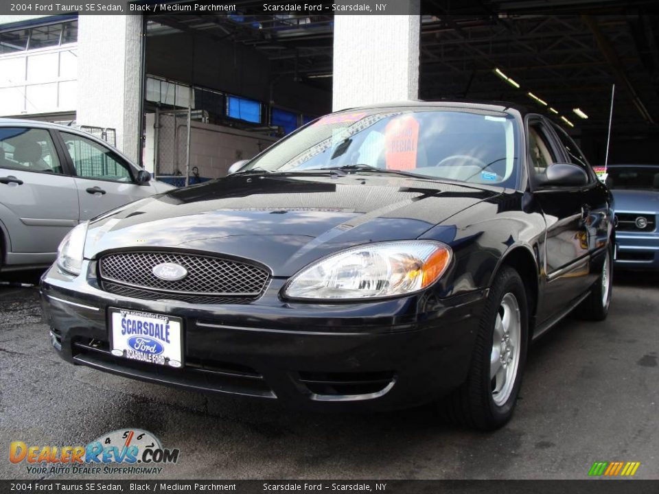 2004 Ford Taurus SE Sedan Black / Medium Parchment Photo #1