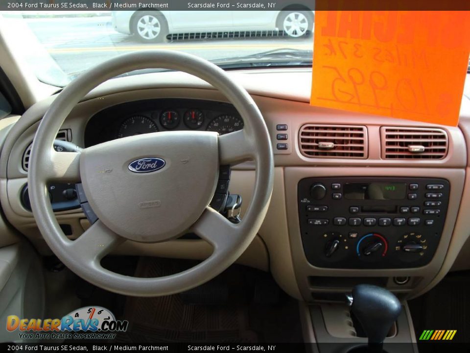 2004 Ford Taurus SE Sedan Black / Medium Parchment Photo #16