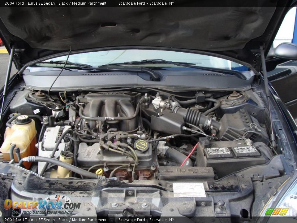 2004 Ford Taurus SE Sedan Black / Medium Parchment Photo #22