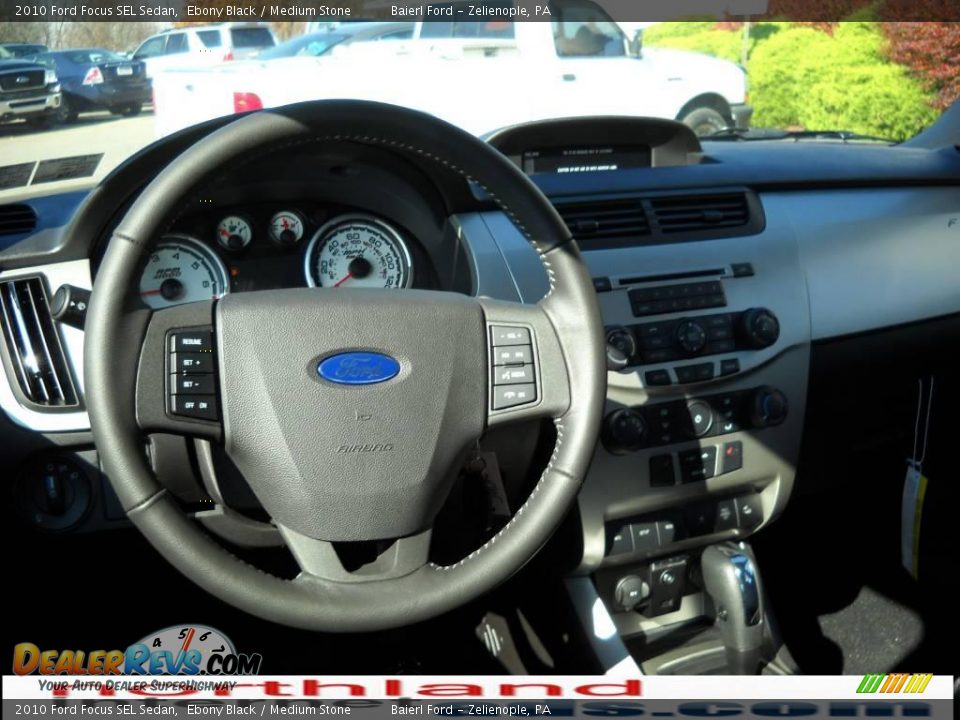 2010 Ford Focus SEL Sedan Ebony Black / Medium Stone Photo #14