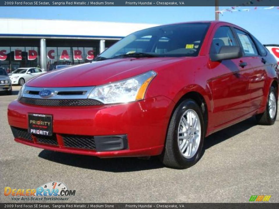 2009 Ford Focus SE Sedan Sangria Red Metallic / Medium Stone Photo #1