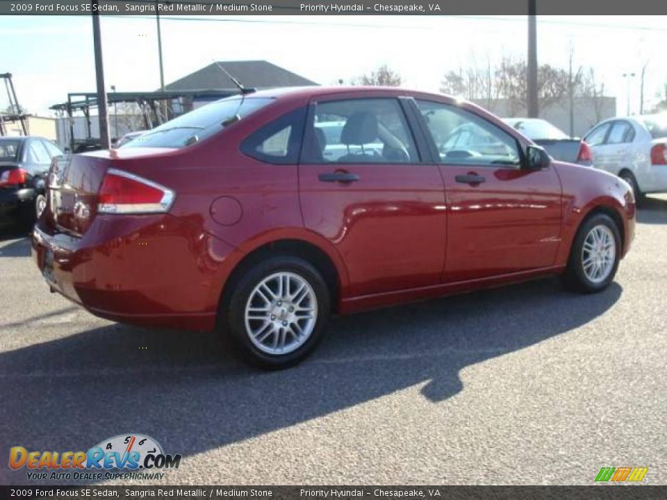 2009 Ford Focus SE Sedan Sangria Red Metallic / Medium Stone Photo #6
