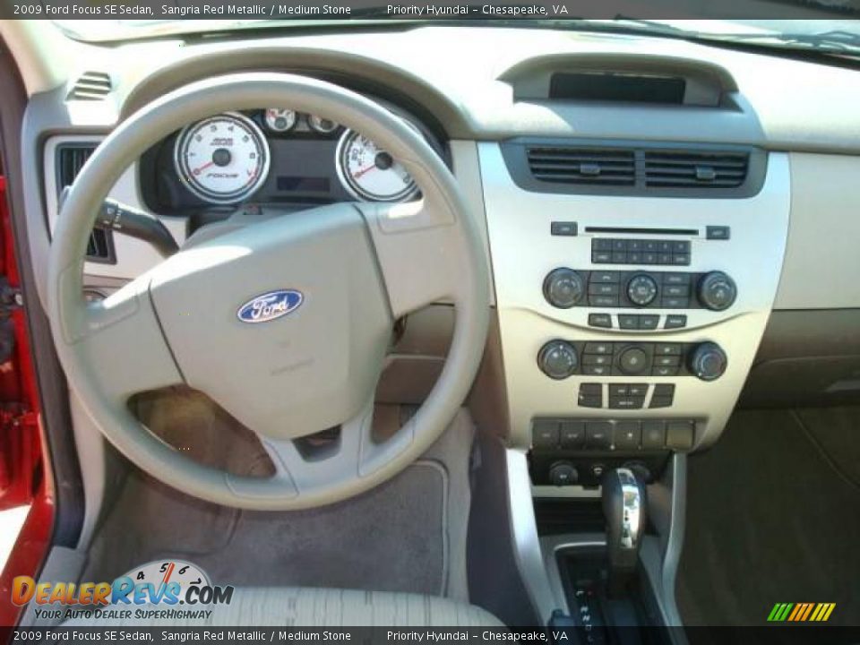 2009 Ford Focus SE Sedan Sangria Red Metallic / Medium Stone Photo #12