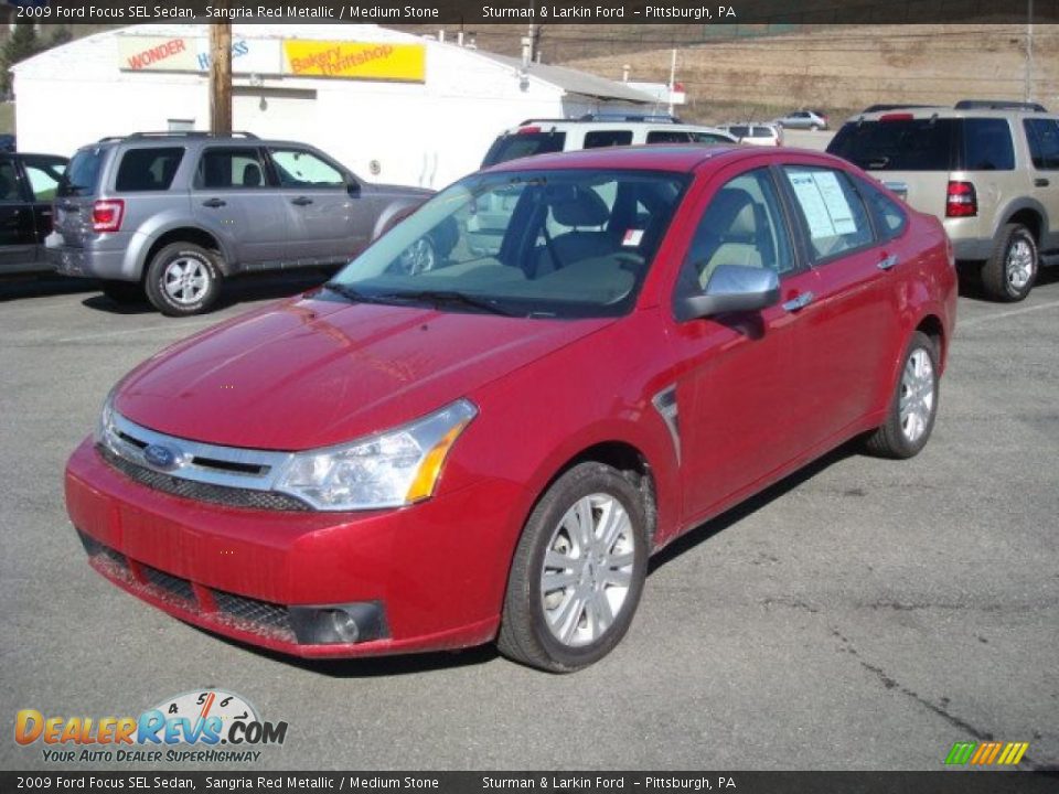 2009 Ford Focus SEL Sedan Sangria Red Metallic / Medium Stone Photo #10
