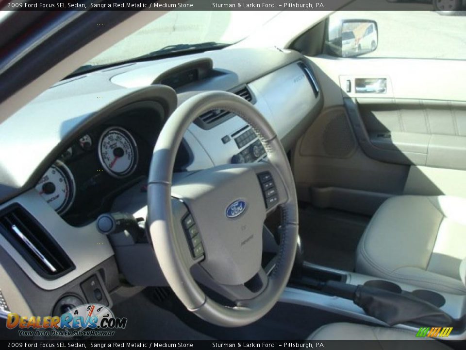 2009 Ford Focus SEL Sedan Sangria Red Metallic / Medium Stone Photo #17