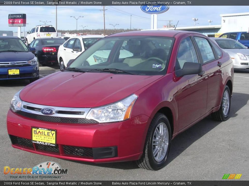 2009 Ford Focus SE Sedan Sangria Red Metallic / Medium Stone Photo #1