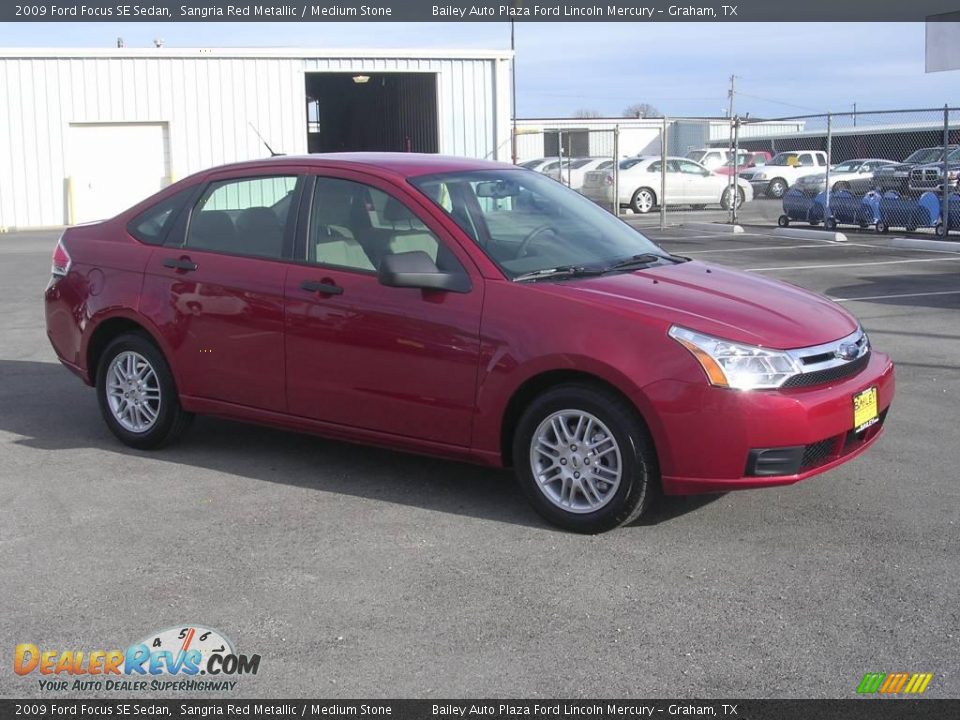 2009 Ford Focus SE Sedan Sangria Red Metallic / Medium Stone Photo #5
